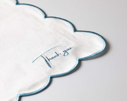 White Napkin With Blue Embroidery